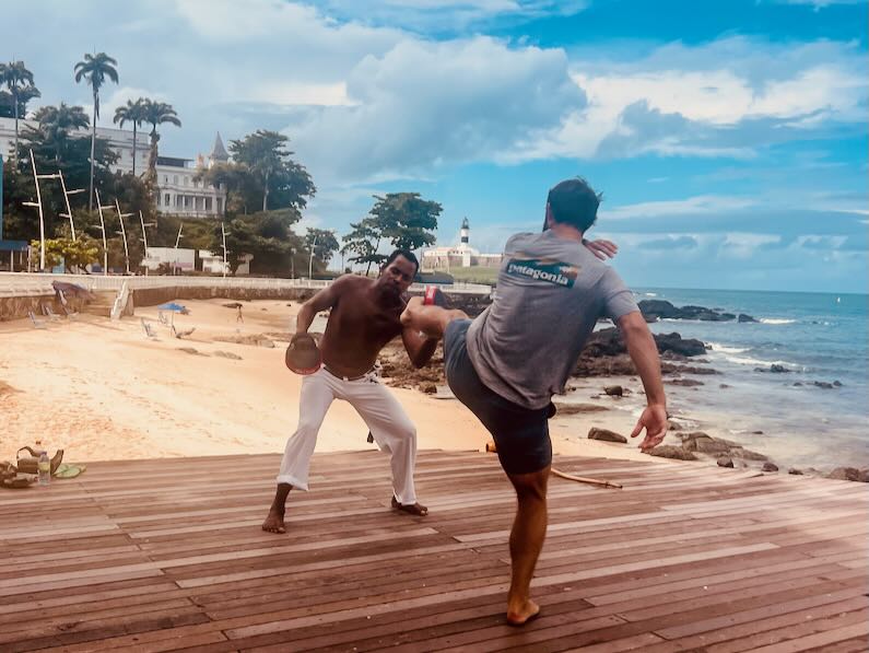 Capoeira lesson in front of the Barra Lighthouse in Salvador, Brazil